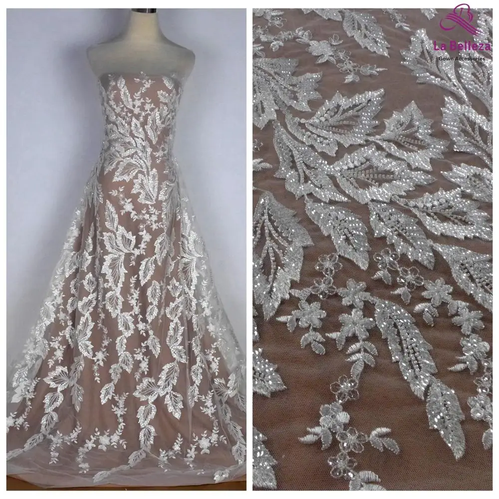 La Belleza новое свадебное платье с блестками и бисером, кружевная ткань с белыми бусинами и блестками, кружевная ткань с узором в виде листьев, кружево 1 ярд
La Belleza новое свадебное платье с блестками и бисером, кружевная ткань с белыми бусинами и блестками, кружевная ткань с узором в виде листьев, кружево 1 ярд