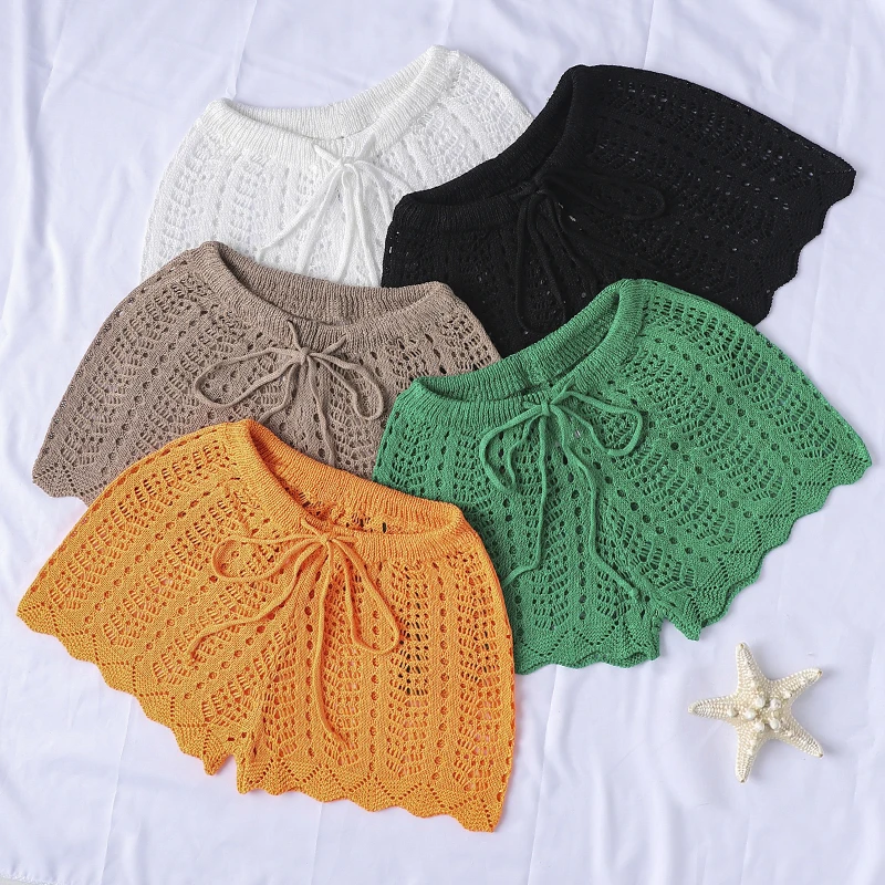 ว่ายน้ําวันหยุดชายหาดกางเกงขาสั้นผ้าถักกลวงออกสีธรรมดาสําหรับฤดูร้อน