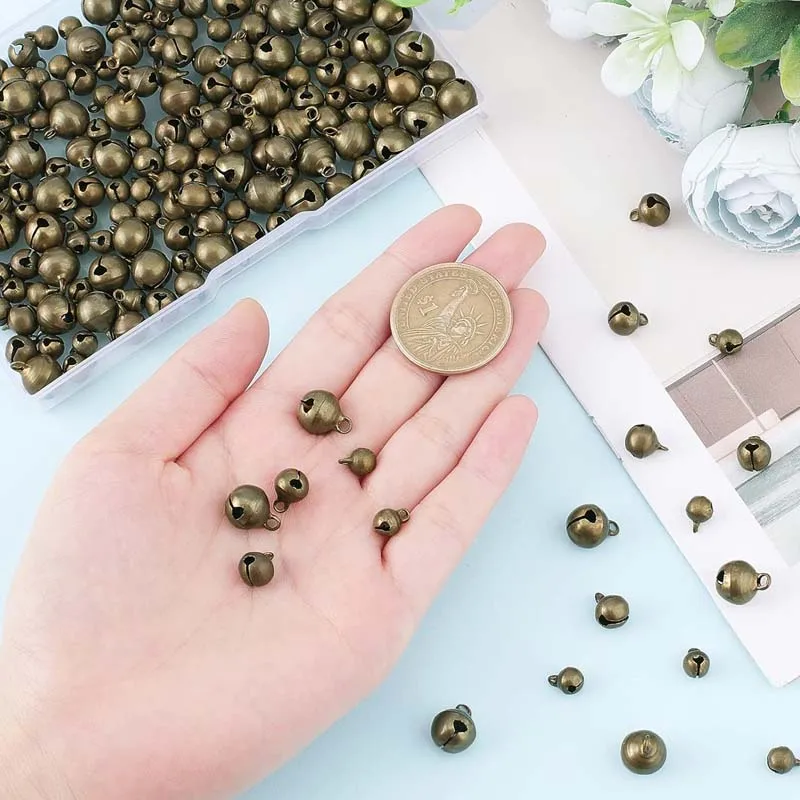 100pcs  Mini Jingle Bell Vintage Bronze Small Elliptical Antique Brass Bell for Crafts and Christmas Halloween Festival Decor