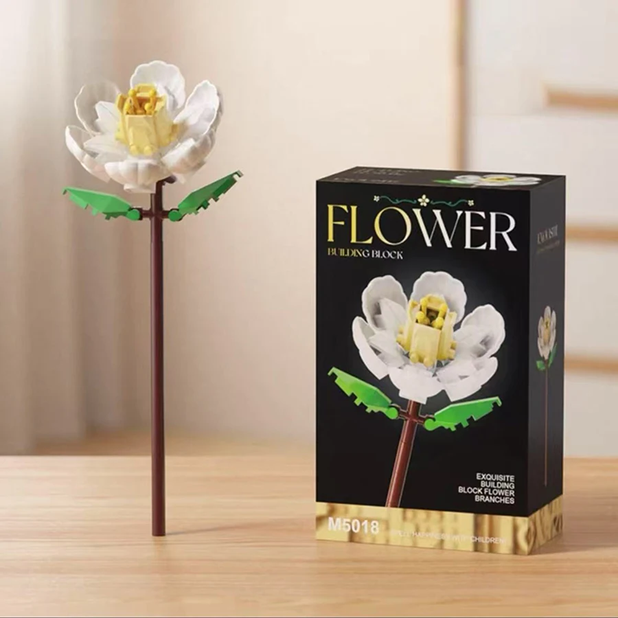 أربعة حلي منضدية على شكل زهرة مكعبات بناء. زنبق، وردة، جاردينيا، مكعبات بناء عشبة المحور. هدايا عيد الميلاد، هدايا المهرجانات.