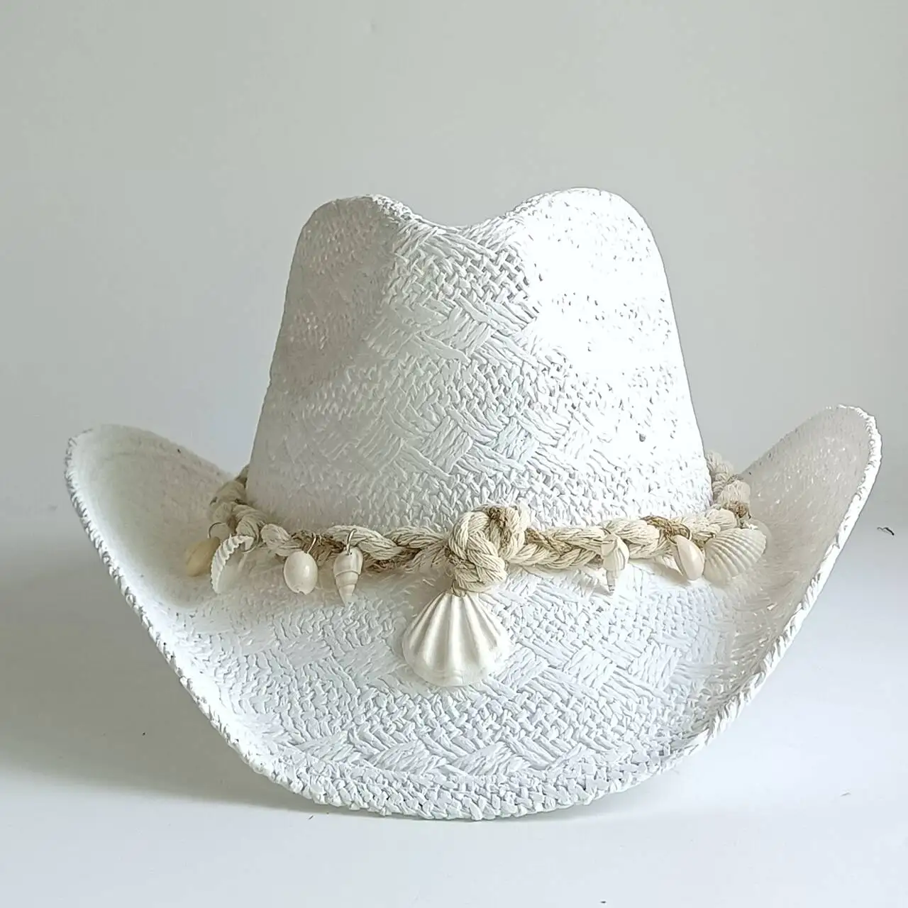 

Livingston unisex white woven straw hat is highly versatile with a wide brim making it suitable for wearing on the sun and beach