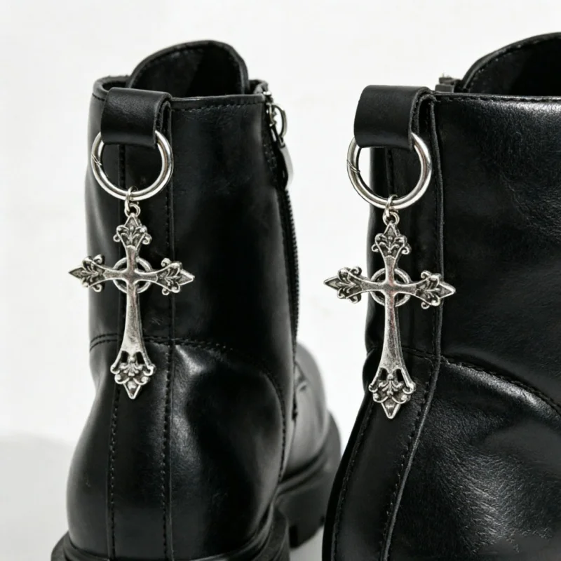 A pair of silver cross shoe charms featuring a vintage pattern a uniquely designed accessory that is versatile for everyday wear