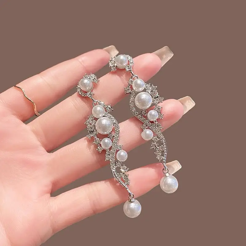 

Elegant Pearl & Crystal Cascade Earrings
