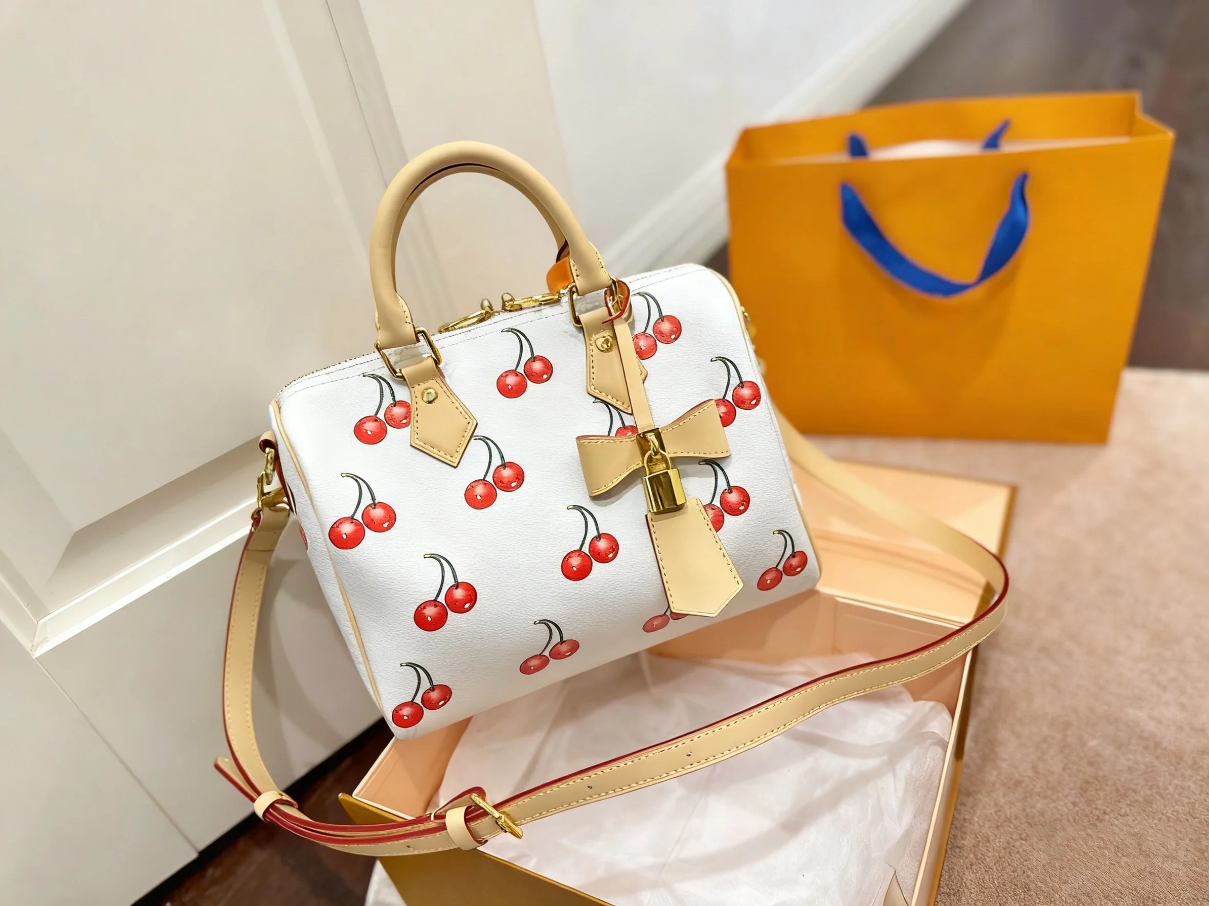 

2025 fashion new women's handbag cherry series cherry series pillow bag hand-held shoulder crossbody 25cm