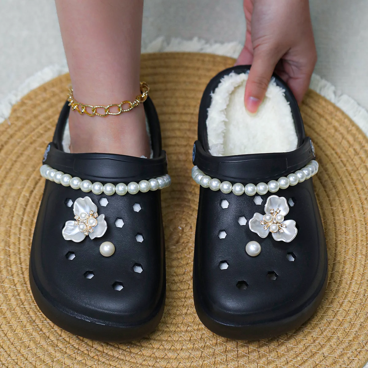A pair of stylish women's winter slippers with fleece lining for warmth and comfort, a perfect gift for your friends
