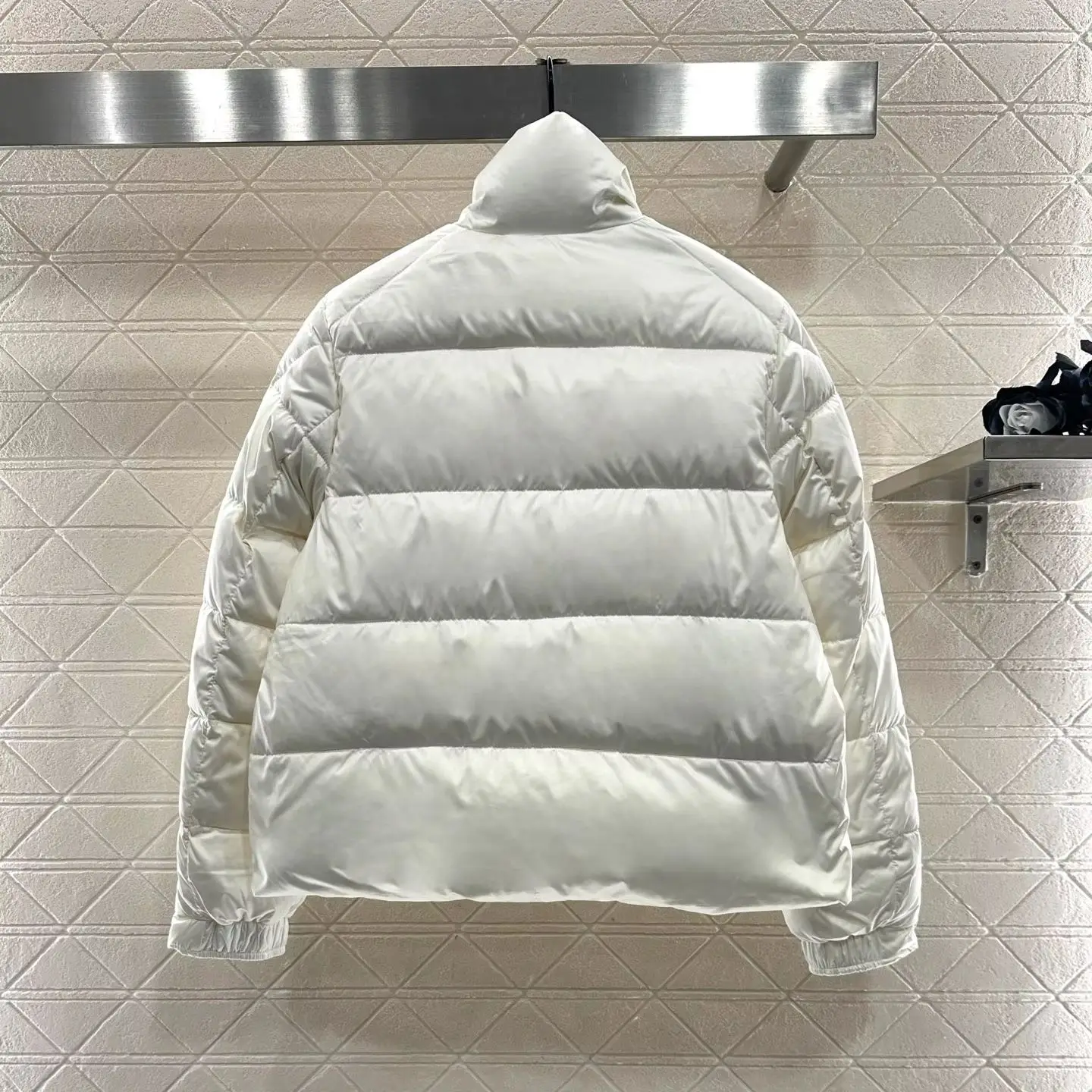 

2025 New Arrivals Rectangular Embossed Stand Up Collar Down Jacket Made of Recycled Nylon and White Goose Down Large Pockets