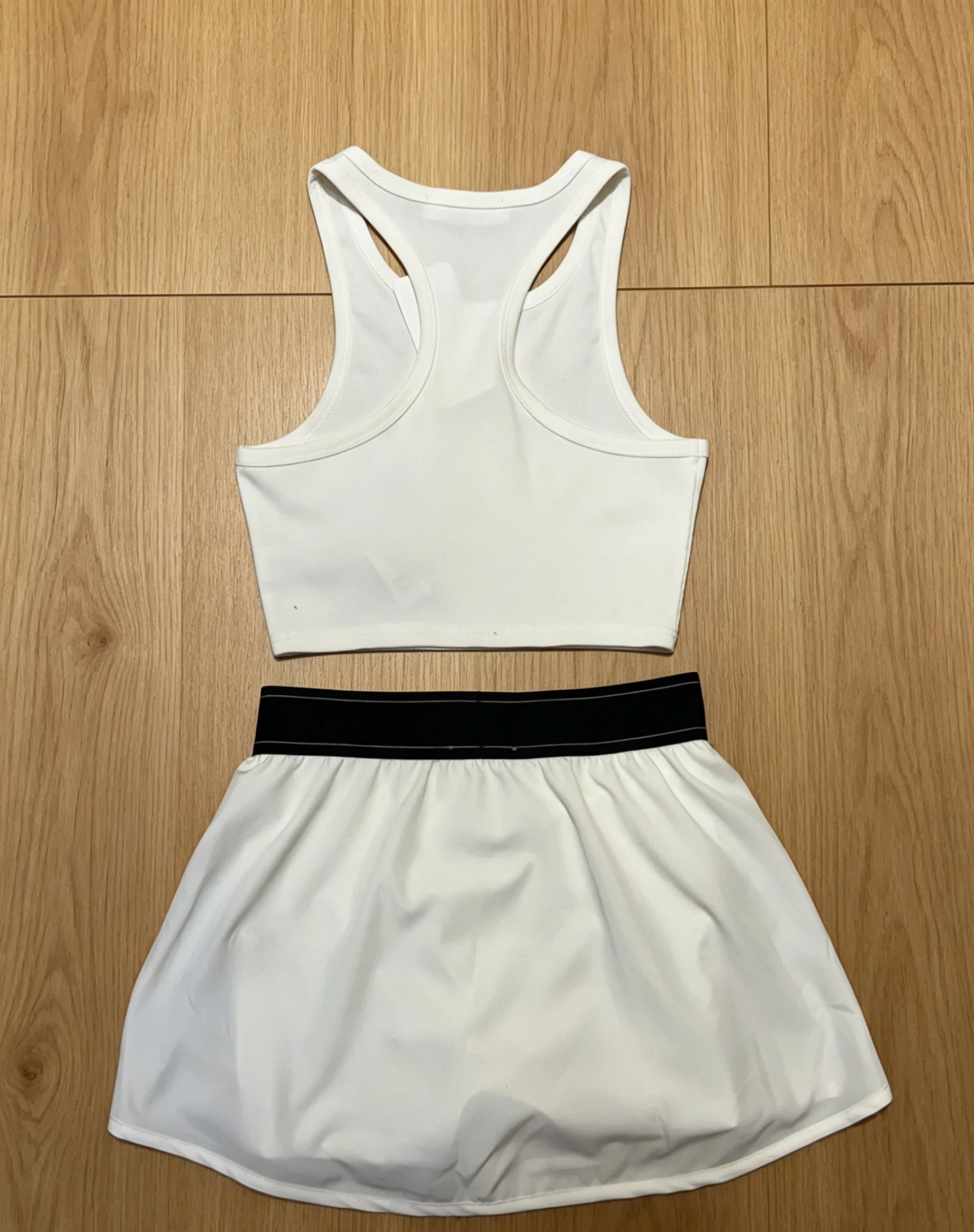 2026 New Style Womens White Vest and Short Skirt Set Size M L Cool and Comfortable Code 038