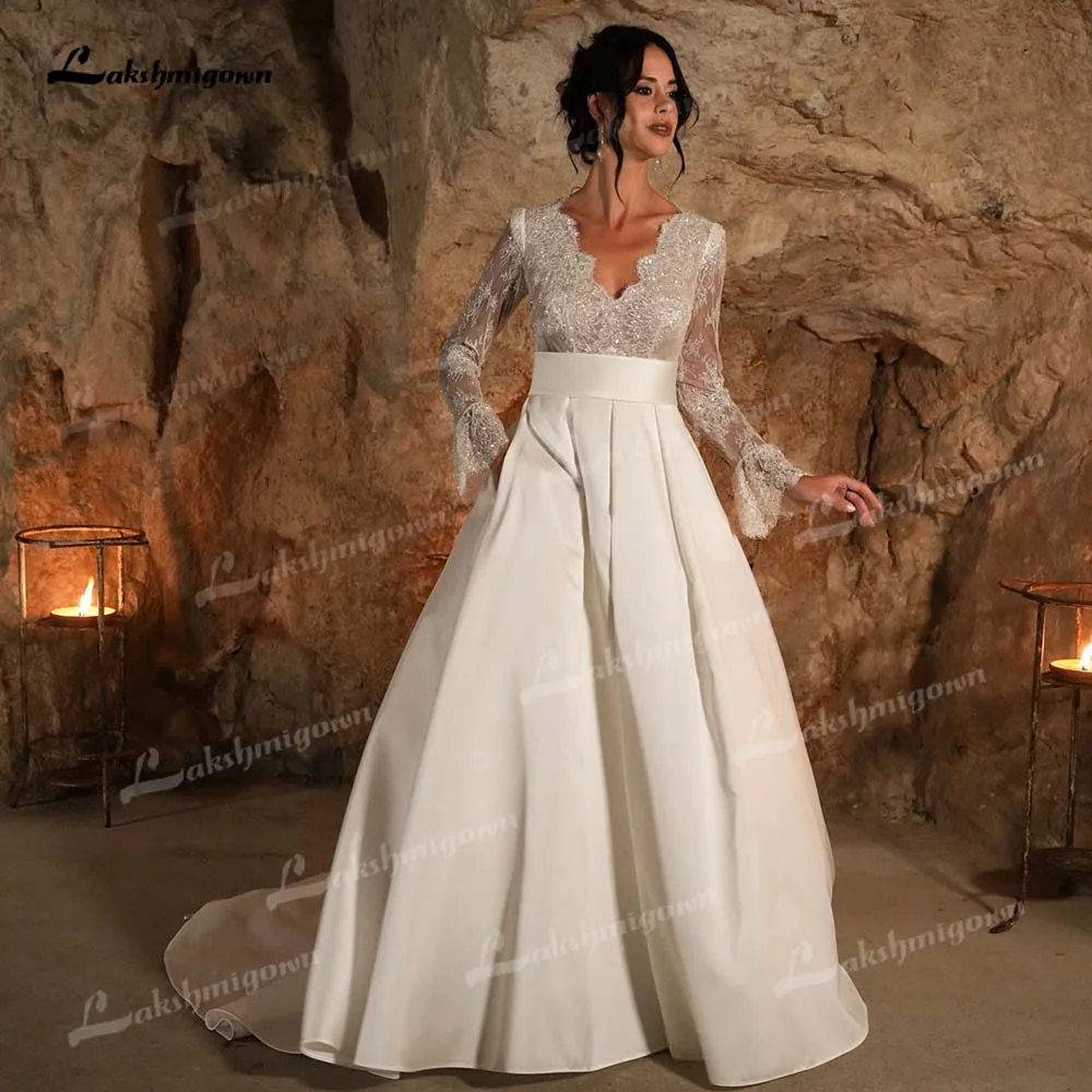 

Lakshmigown Long Lace Sleeves Pockets Wedding Dress 2026 V-Neck A-Line Sweep Train Bridal Gown Vestidos Para Mujer Customized