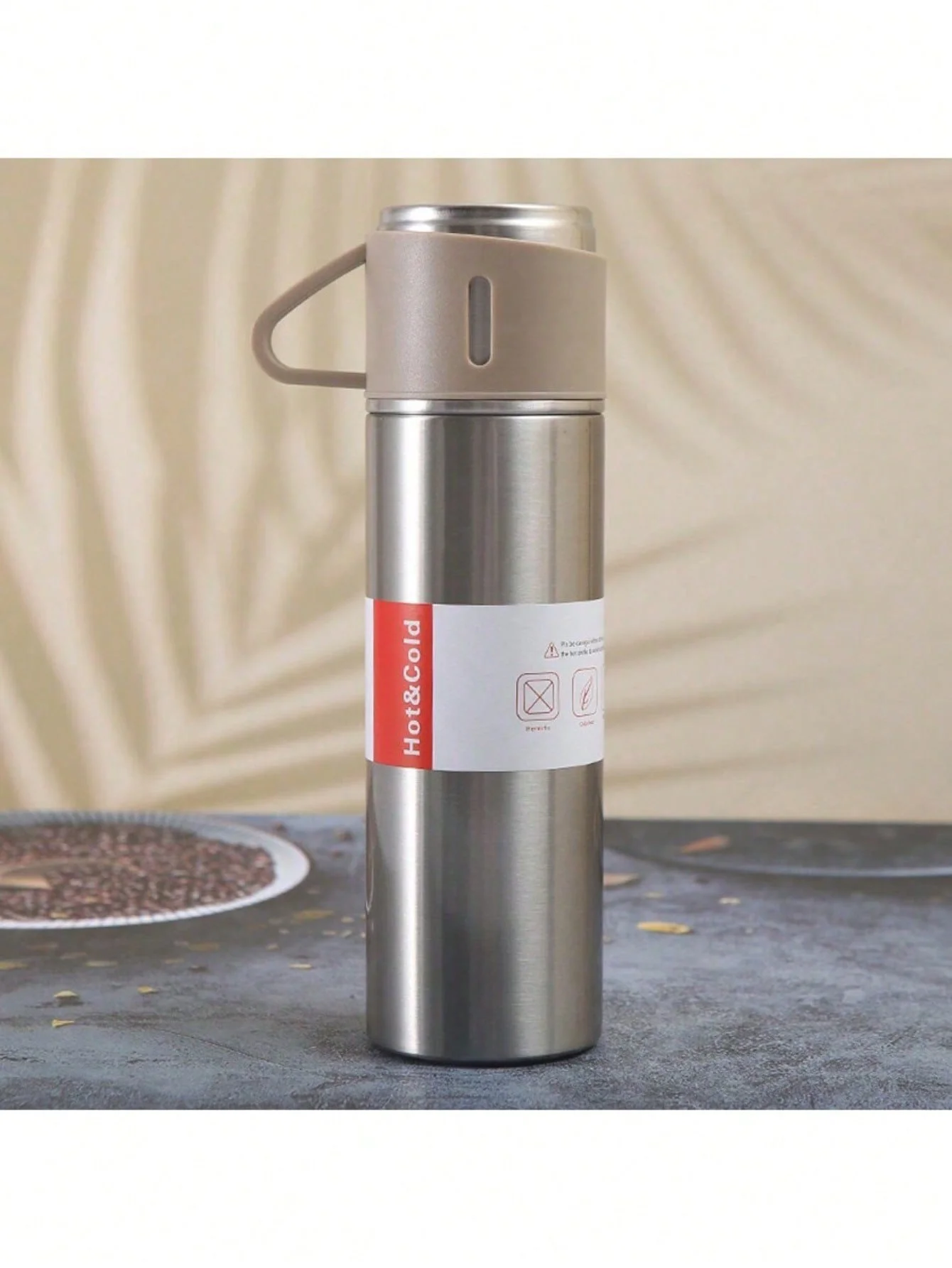 Thermos Vacuum water bottle for hot and cold drinks with 3 cups.