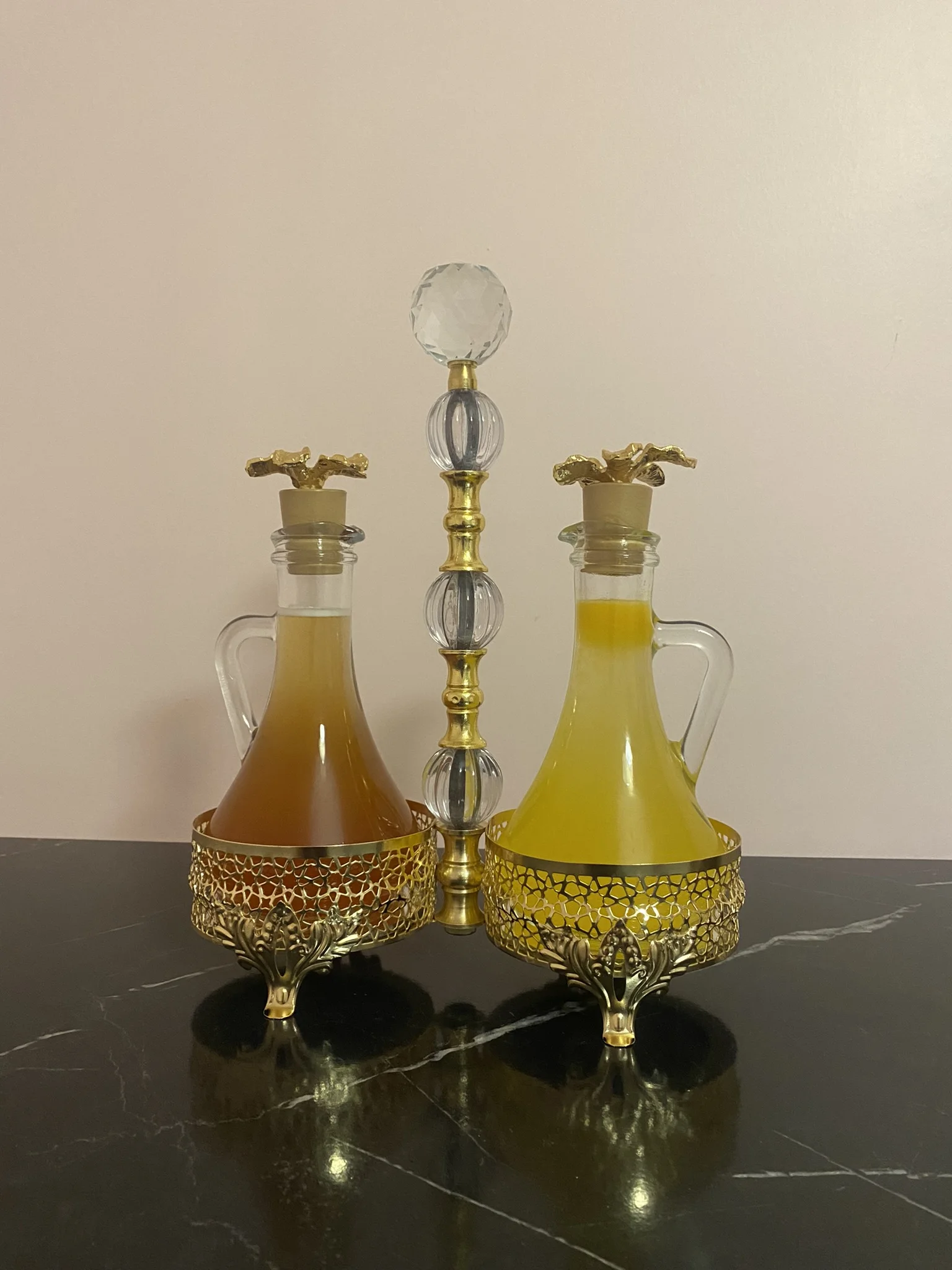 

Elegant Stylish Olive Oil And Vinegar Dispenser Sauce Bowl 2 Bottles Gold Dining Table, Kitchen Decoration Metal and Glass Compatible High Quality Crystal Top Leg Stand Produced with Workmanship