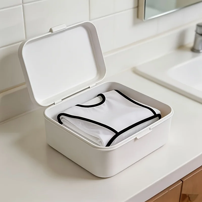 

A stylish white grooming cape with a sleek design, paired with a lightweight black comb. The foldable hair care cape is an excellent high-quality cape for household grooming purposes, easy to clean, suitable for shaving and trimming. Home use apron, folda