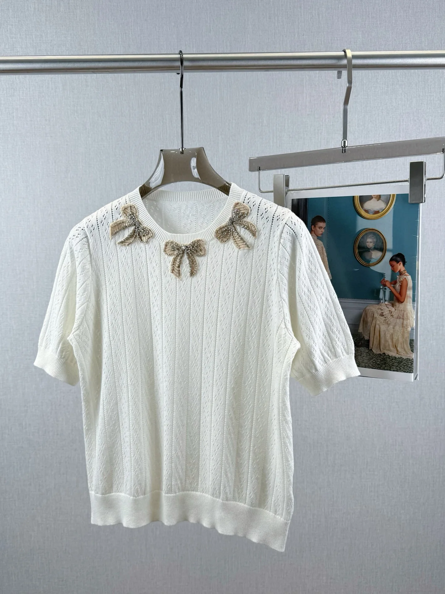 

Elegant exquisitely decorated women's short sleeved knitted blouse