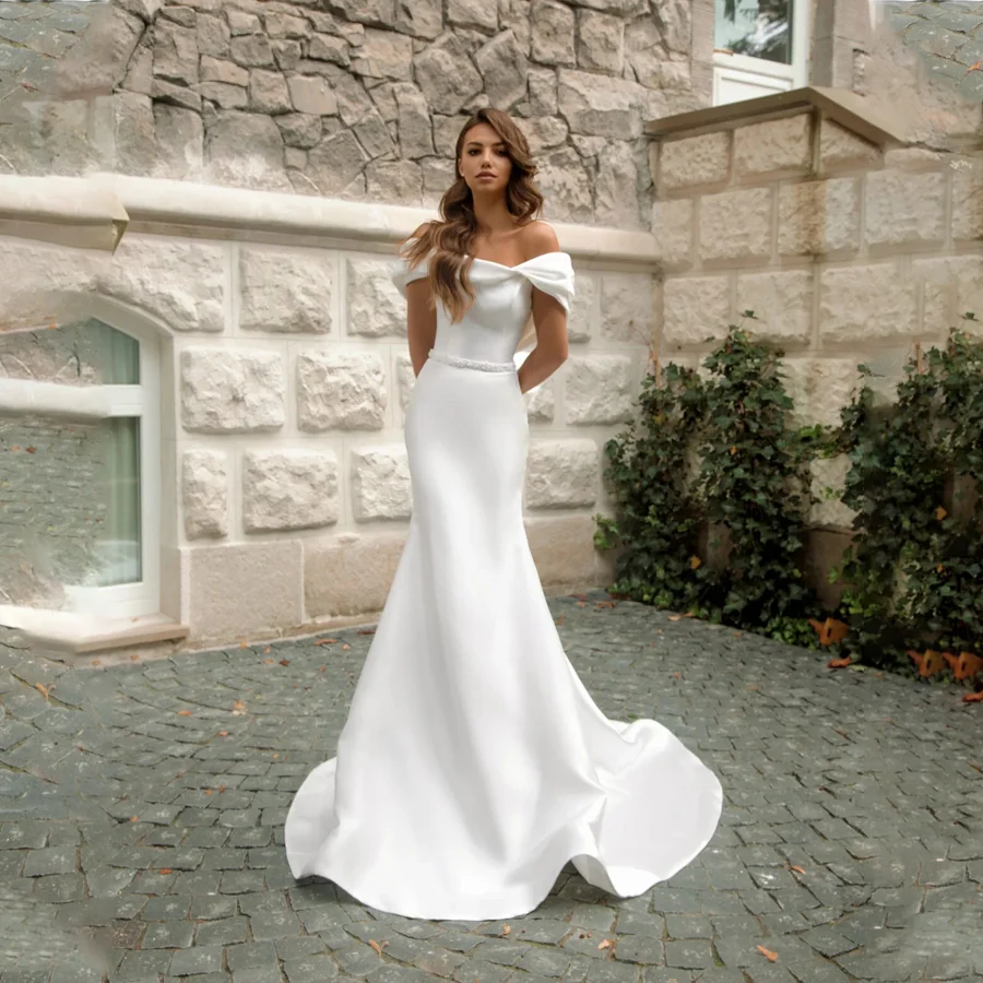 

Captivating Satin Mermaid Wedding Dress Features Beaded Belt And Bow Tie Women Striking Bridal Gown with Off-the-Shoulder Straps