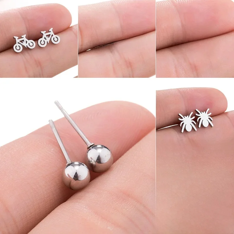 AliExpress SMJEL Small Stainless Steel Om Symbol Stud Earrings for Women Men Hip hop Ball Bicycle Cross Key Earrings Ear Pendientes Wholesale