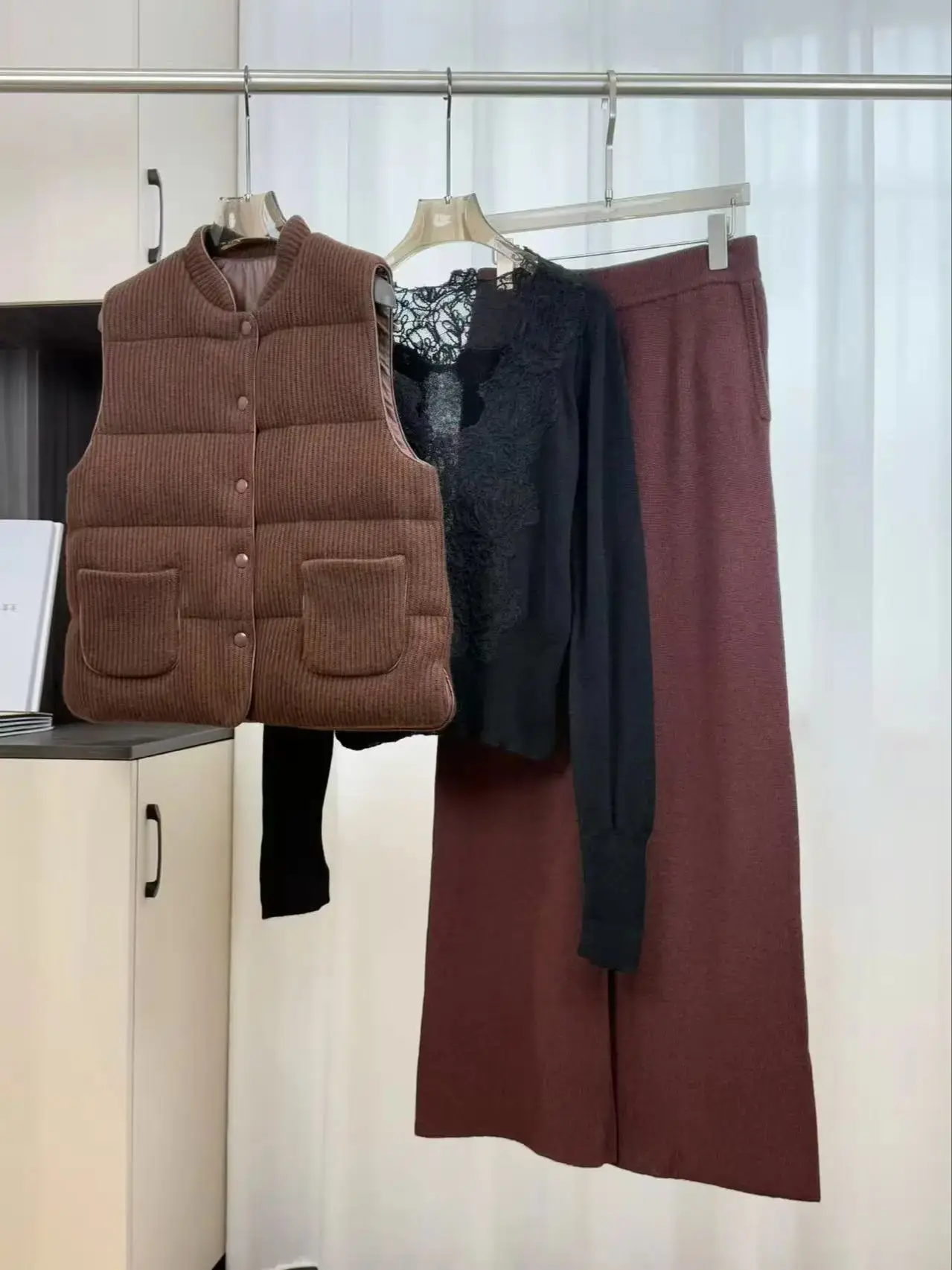 

Casual women's matching three-piece suit with goose down vest