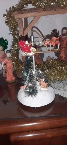 Animated Christmas Village Flying Sleigh with Rotating Santa Figurines Musical Light-Up Holiday Decorations Accessory photo review