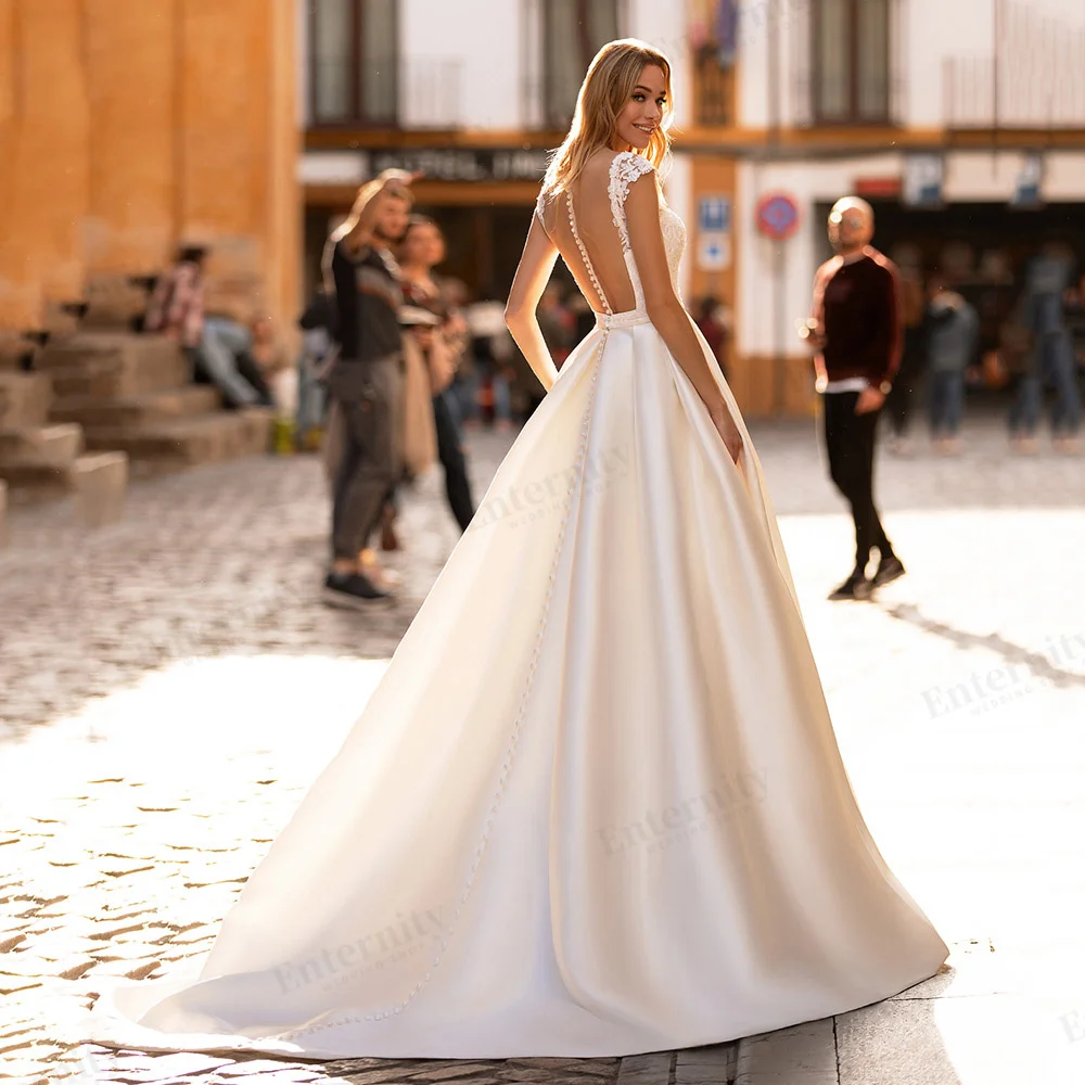 Vestido De Novia personalizado con cuello redondo y mangas casquillo, apliques De encaje hasta el suelo, vestido De Novia con botones y espalda descubierta