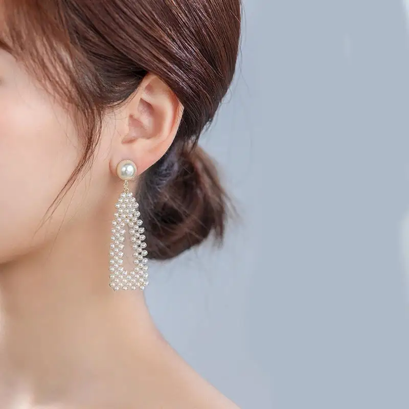 

Opulent Pearl Cascade Earrings