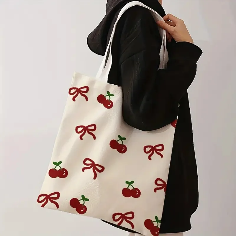 1 Piece of Cute Cherry Bow Canvas Shoulder Bag, Lightweight Foldable Storage Tote Bag, Reusable Shopping Bag with Fixed Shoulder Strap, Perfect Gift for Commuting, Travel, Shopping, School, and Holidays