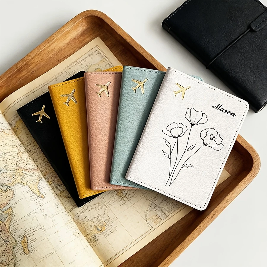 

A Customizable Passport Holder with a Easy Floral Design, Available in Yellow, Blue, White, Black, And Pink.