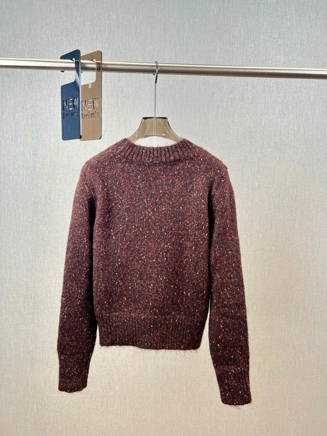 Stylish wool sweater with multi-colored inclusions