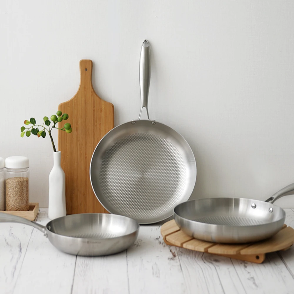 SwissTugartu a three-layer stainless-steel frying pan