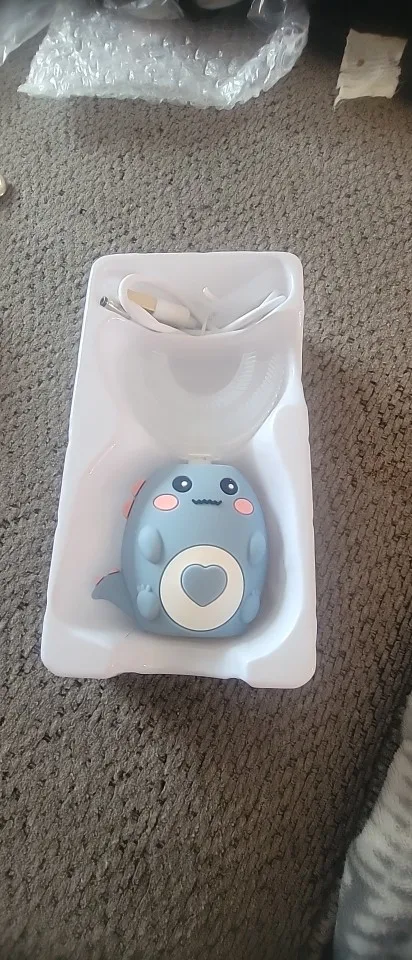 Elektrische Kinderzahnbürste in U-Form Foto-Test