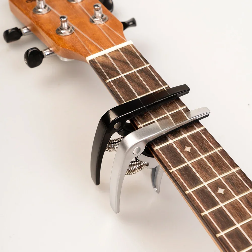 GUITTO GGC-07 ukulélé Capodastre rapide en alliage de Zinc Ukelele changement pince de réglage 4 cordes Hawaii guitare Capodastre guitare pièces et accessoires