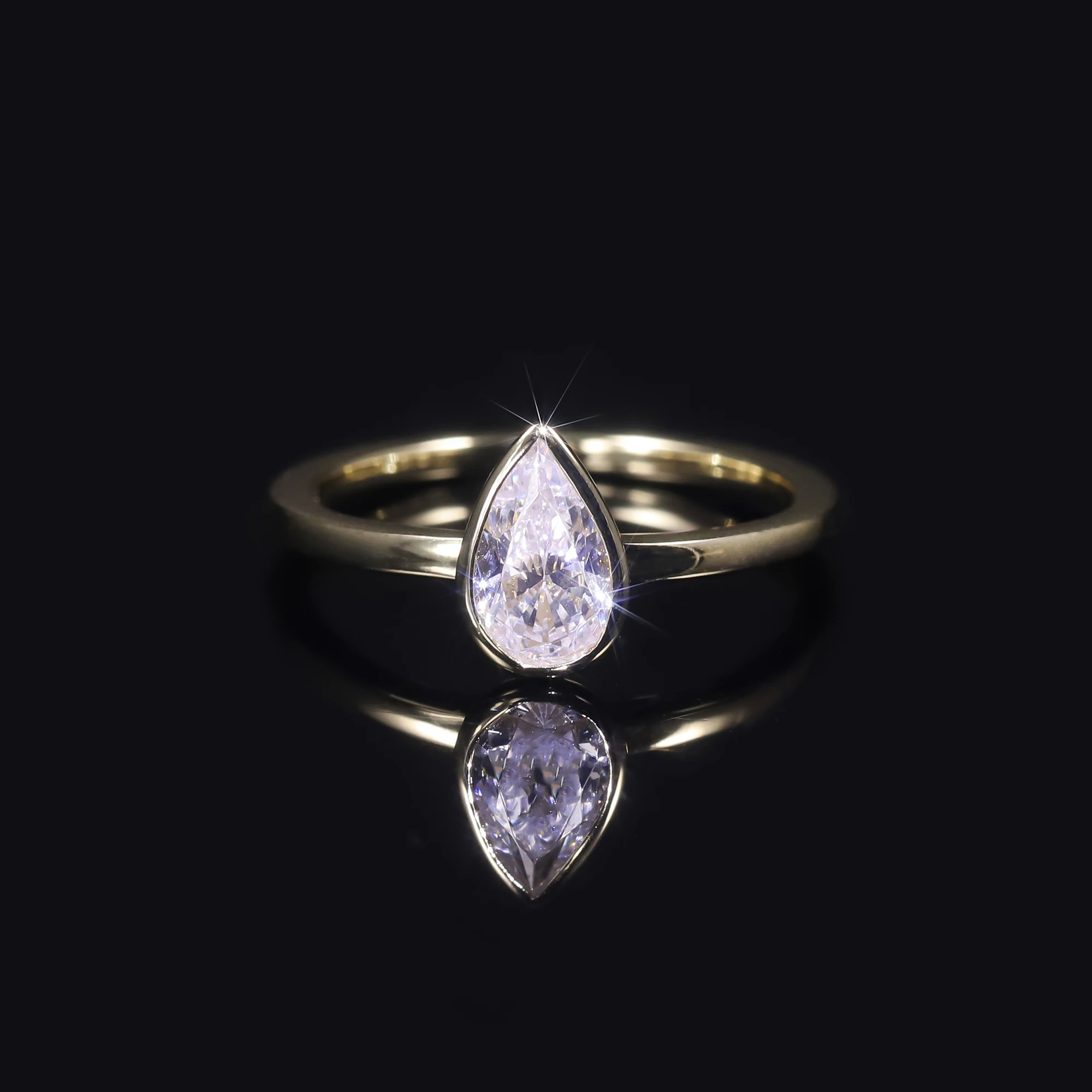 

GEM'S BALLET 1.0CTW 5x8mm Pear Shape Moissanite Noemi Bezel Engagement Ring in 18k Gold Plated 925 Sterling Silver