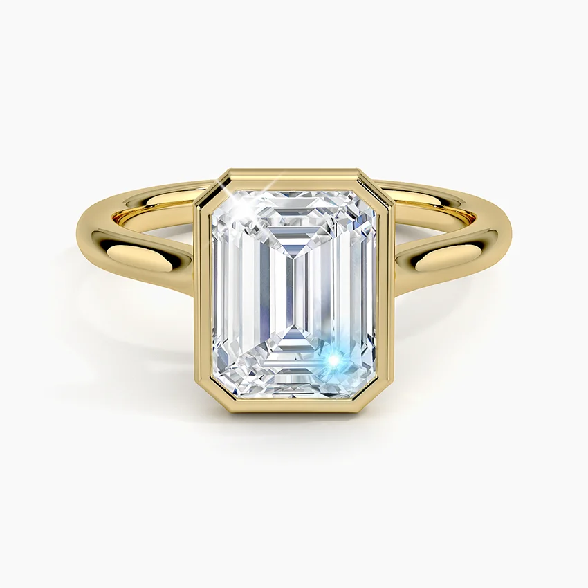 

GEM'S BALLET 1.0CTW 5x7mm Emerald Cut Moissanite Noemi Bezel Engagement Ring in 18k Gold Plated 925 Sterling Silver