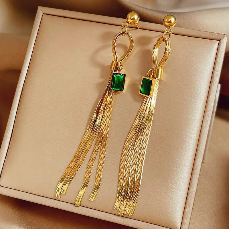 

Gold Tassel Earrings – Glamorous Drop with Radiant Green Crystal