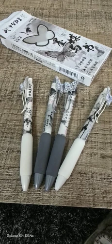 4PCS/Set Soft Grip Gel Pen Press Type 0.5mm Black Ink Ballpoint Pen Butterfly Patch Neutral Pen Gift Writing Tools photo review