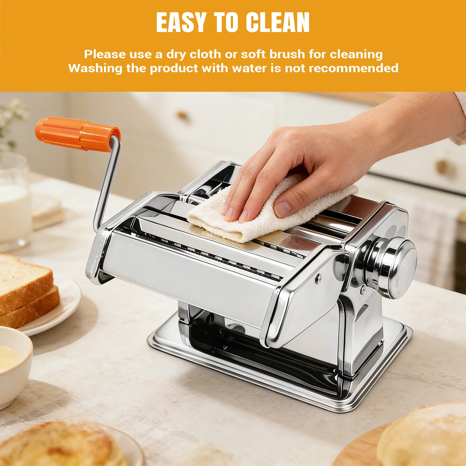 Fresh lasagna sheets being rolled through manual pasta maker machine