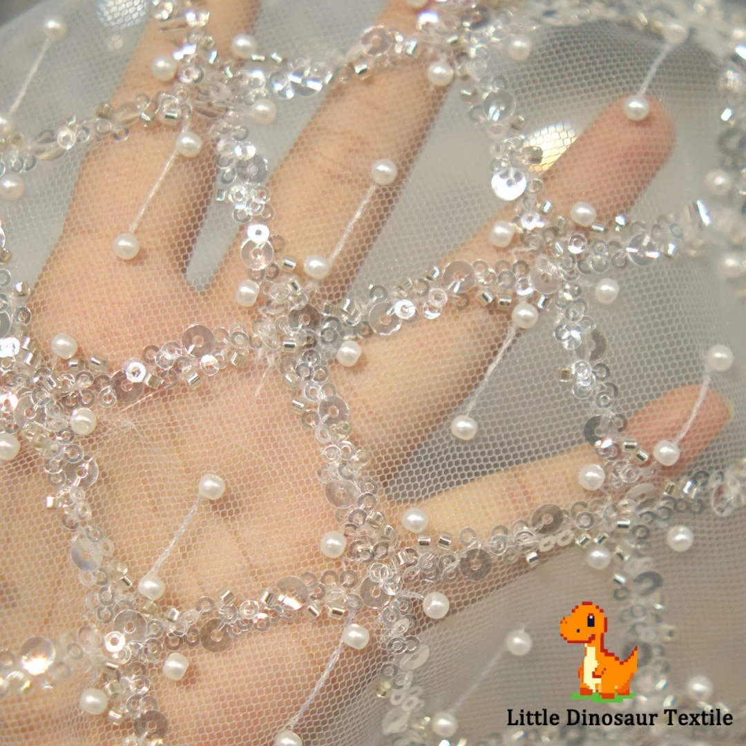 

Interwoven Pearl Sequin Lace Fabric with Elegant Diamond Fish Scale Motif for Bridal Dresses Wedding Gowns and Designer Use