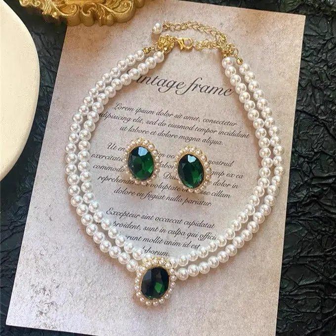 

Luxury Emerald & Pearl Double-Strand Necklace & Earrings Set