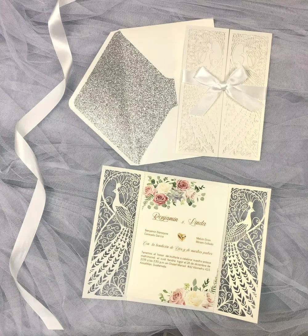 

50sets pearl ivory peacock laser pockets +ivory envelopes with siver glitter printing + pearl ivory printing inserts + ribbon