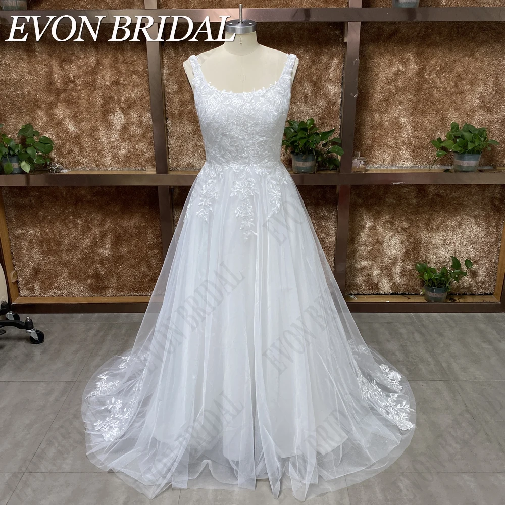 فستان زفاف من EVON BRIDAL بتصميم حقيقي وياقة مربعة مزين بحمالات من الدانتيل ، فستان عروس أنيق بدون ظهر مصنوع حسب الطلب حقيقيّ يربّت حزب عنق 2024 Wonmen عروس عرس ثوب Applique شريط شريط شريط أسود ثوب أنيق مفتوح ظهر زرّ ع