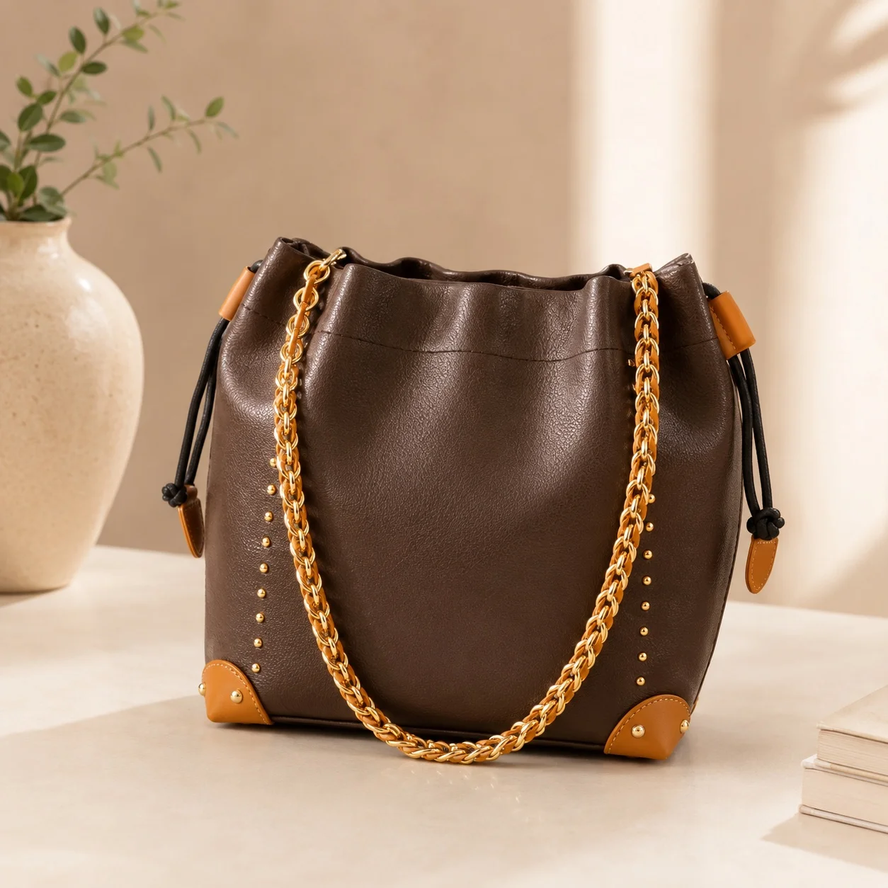 

2026 New Luxury Bucket Bag with Metal Corner Trim and Rivet Decoration down details 25 x 21 x 8 cm