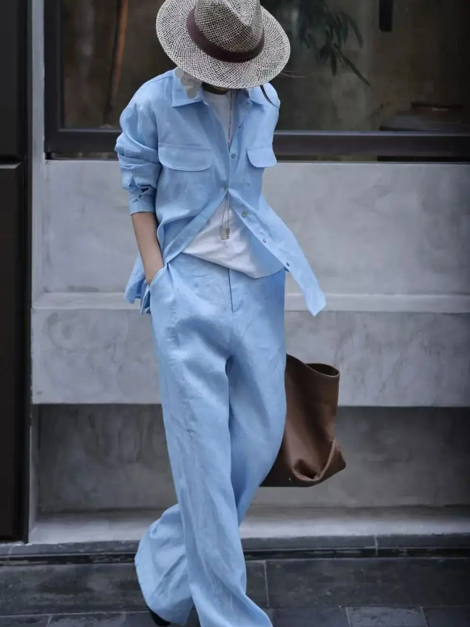 Terno de calças de linho puro feminino mínimo no início do outono