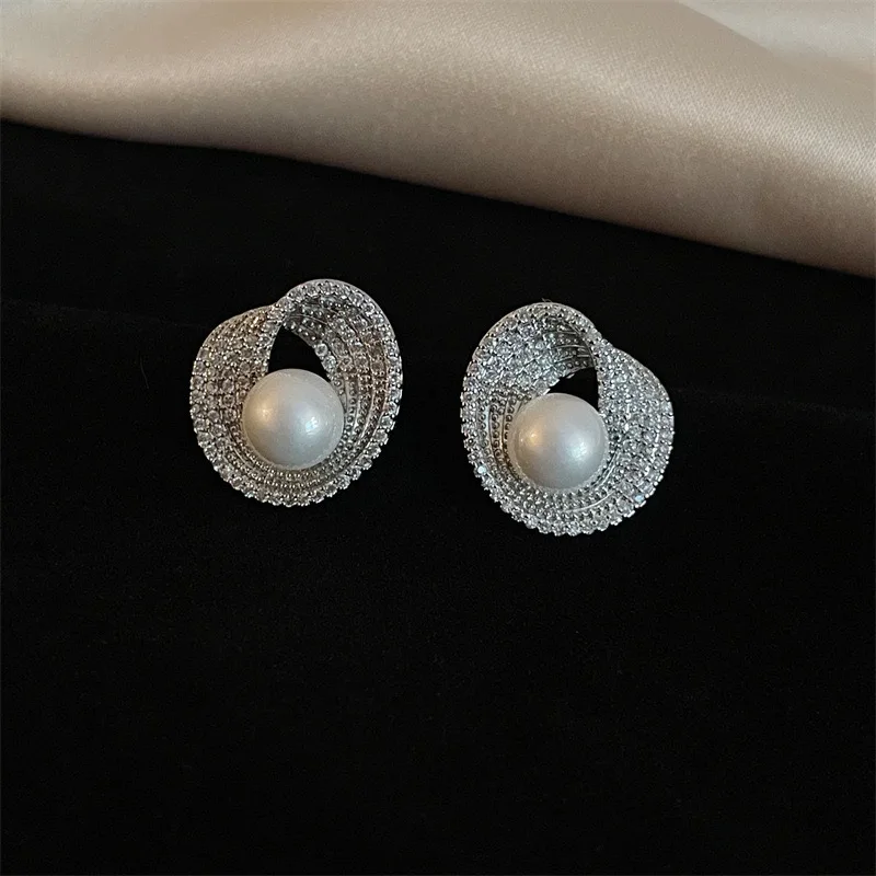 

Elegant Pearl Stud Earrings for Women – Micro Paved Crystal Swirl Design