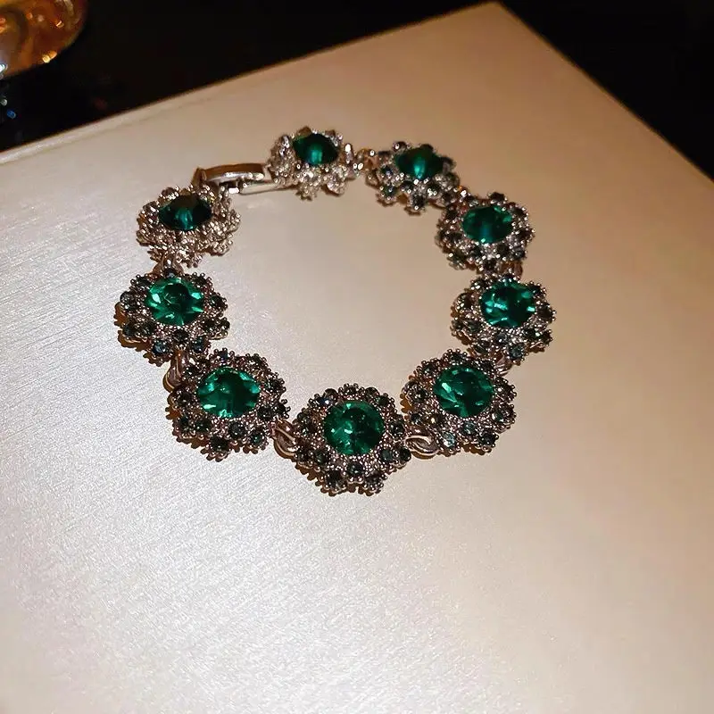 

Emerald Elegance Floral Bracelet