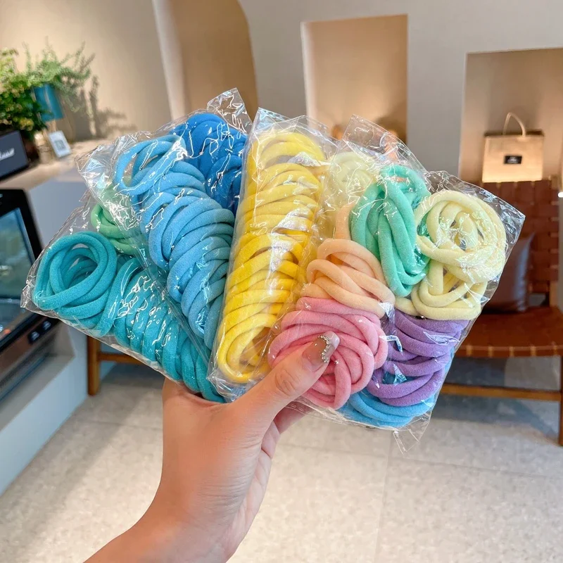 50 pièces/ensemble femmes filles coloré en Nylon élastique bandes de cheveux élastique pour queue de cheval bandes de caoutchouc Scrunchie chapeaux accessoires de cheveux