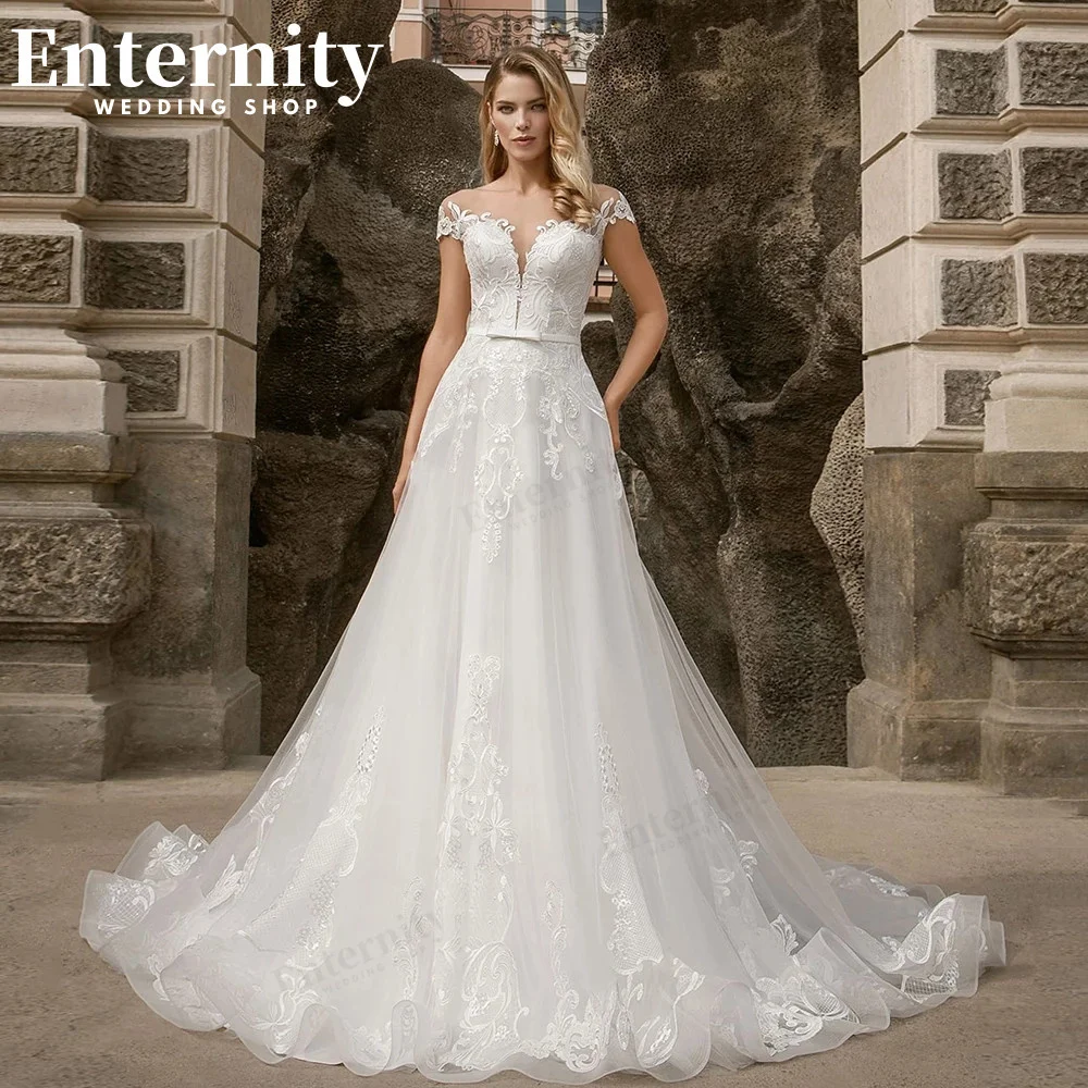 Flamboyance-vestidos de novia acampanados, ropa de novia transparente con cuello redondo, mangas casquillo, Apliques de encaje, tren de barrido,