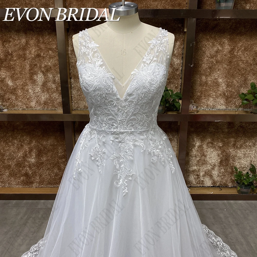 EVON BRIDAL 우아한 웨딩 드레스, 2024 구슬 스파게티 스트랩, V-넥 레이스, 백리스 신부 가운, 보호 맞춤 제작 여성을위한 우아한 웨딩 드레스 2024 비즈 스파게티 스트랩 로브 드 마리 에 브이넥 레이스 백리스 신부 가운 보헤미안 맞춤형 튤 민소매 신부 드레스와 버튼 스윕 기차 우아한 여성 웨딩드레스 2024 구슬 스파게티 멜빵 로브 de mariée V 칼라 레이스 등없