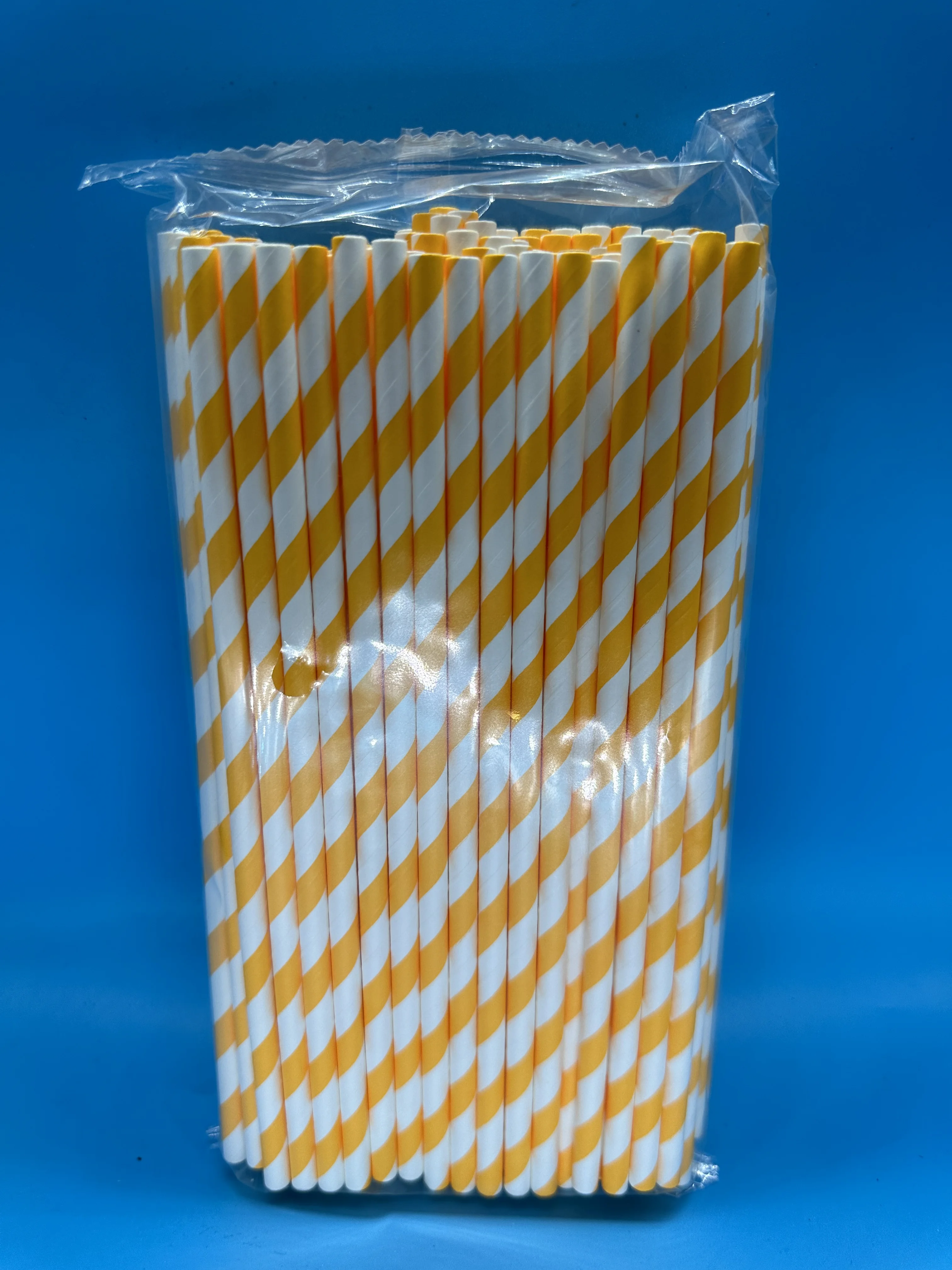 A Case of 10,000 Disposable Orange and White Striped Paper Straws - Fresh Party Companions for Juice