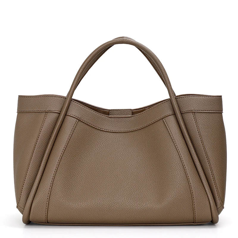 A minimalist style solid color women\'s handbag made of high-quality cowhide material, which is a soft and large bag