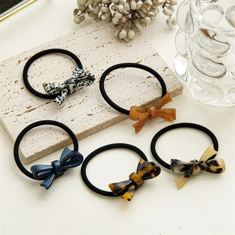 Moda koreański styl kwas octowy akrylowy łuk opaska do włosów Leopard Tortoise plastikowe Bowknot elastyczna opaska do włosów kobiety kucyk Holder — zdjęcie 2