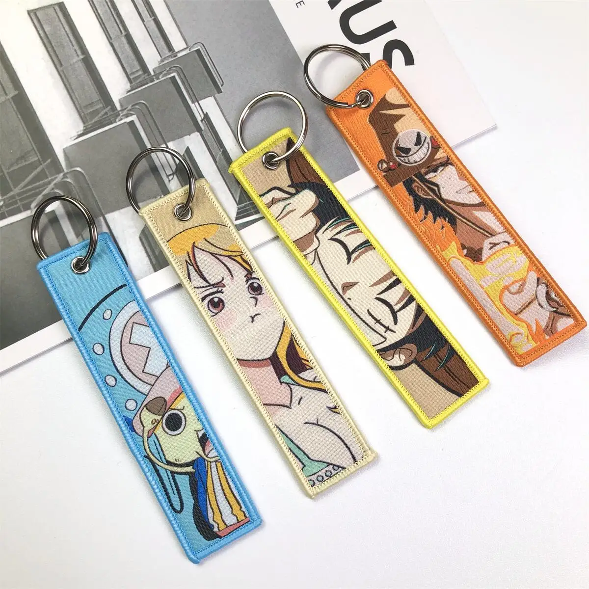 One Piece Anime Key Chains with Cute Jet Manga Embroidery Fashion Key Tag for Jewelry Accessory Key Ring Holder Gift Anime Fans