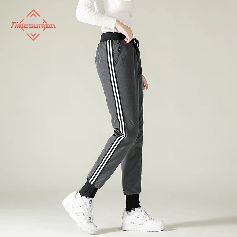 Calça de inverno para mulheres Calça de cintura alta com elástico elegante e casual para baixo Calça clássica de lápis de pato branco 90% espessa para mulheres