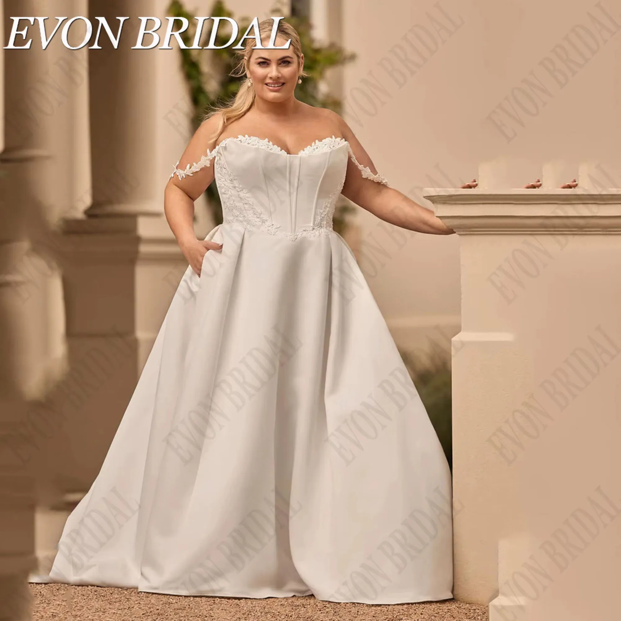 ชุดแต่งงานผ้าซาตินไซส์ใหญ่ แบบเปิดไหล่ ทรงเอไลน์ วินเทจ ชุดเจ้าสาวสำหรับผู้หญิง พร้อมกระเป๋า  EVON BRIDAL รับตัดตามสั่ง